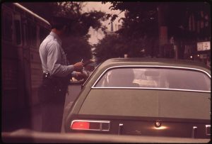 vintage photo of driver being ticketed by police officer