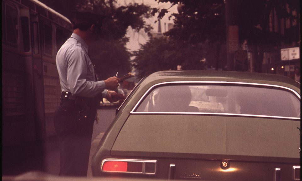 vintage photo of driver being ticketed by police officer