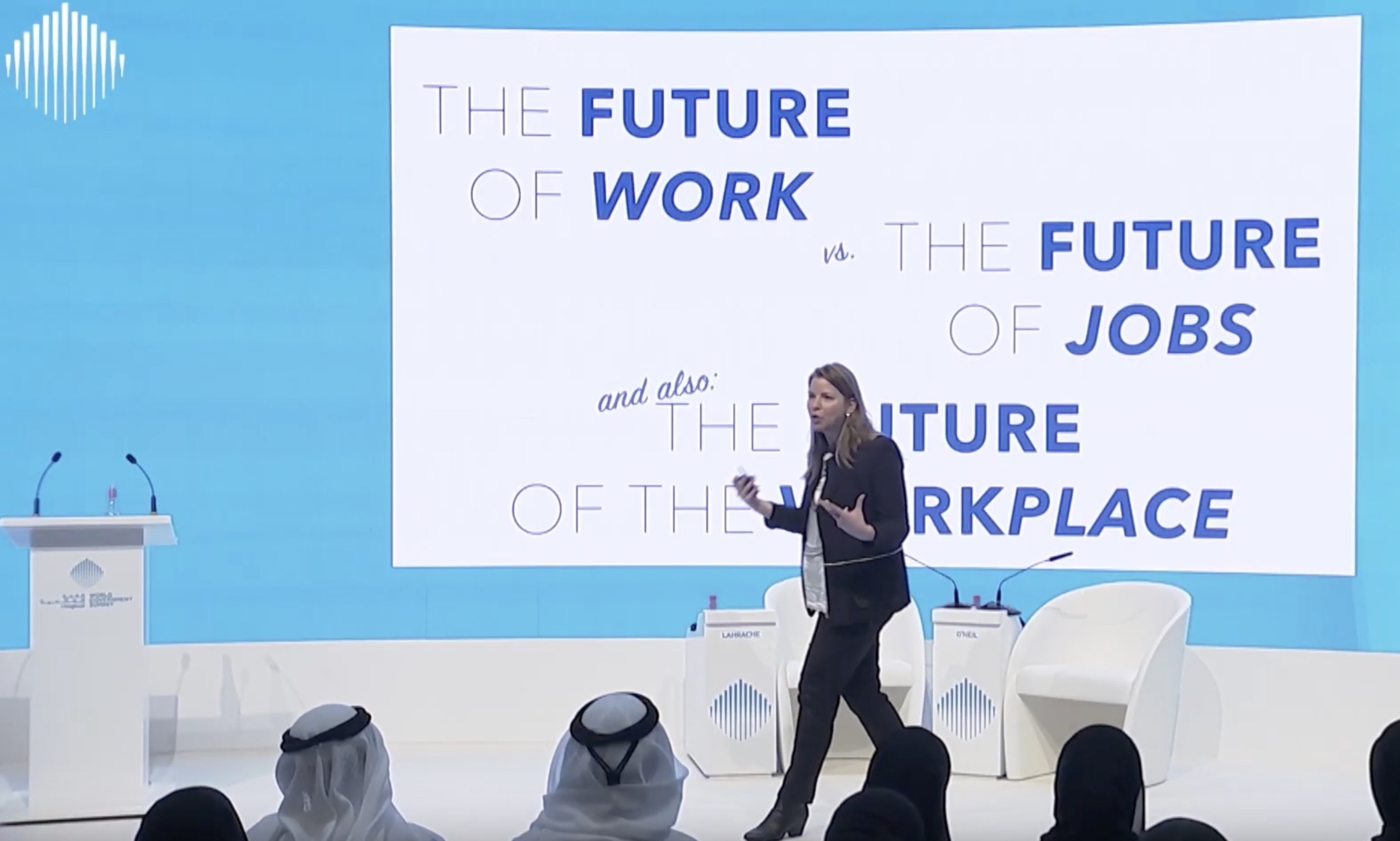 Kate O'Neill speaking on stage at the World Government Summit in 2022